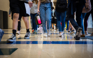  Students' feet as they walk down a hallway
